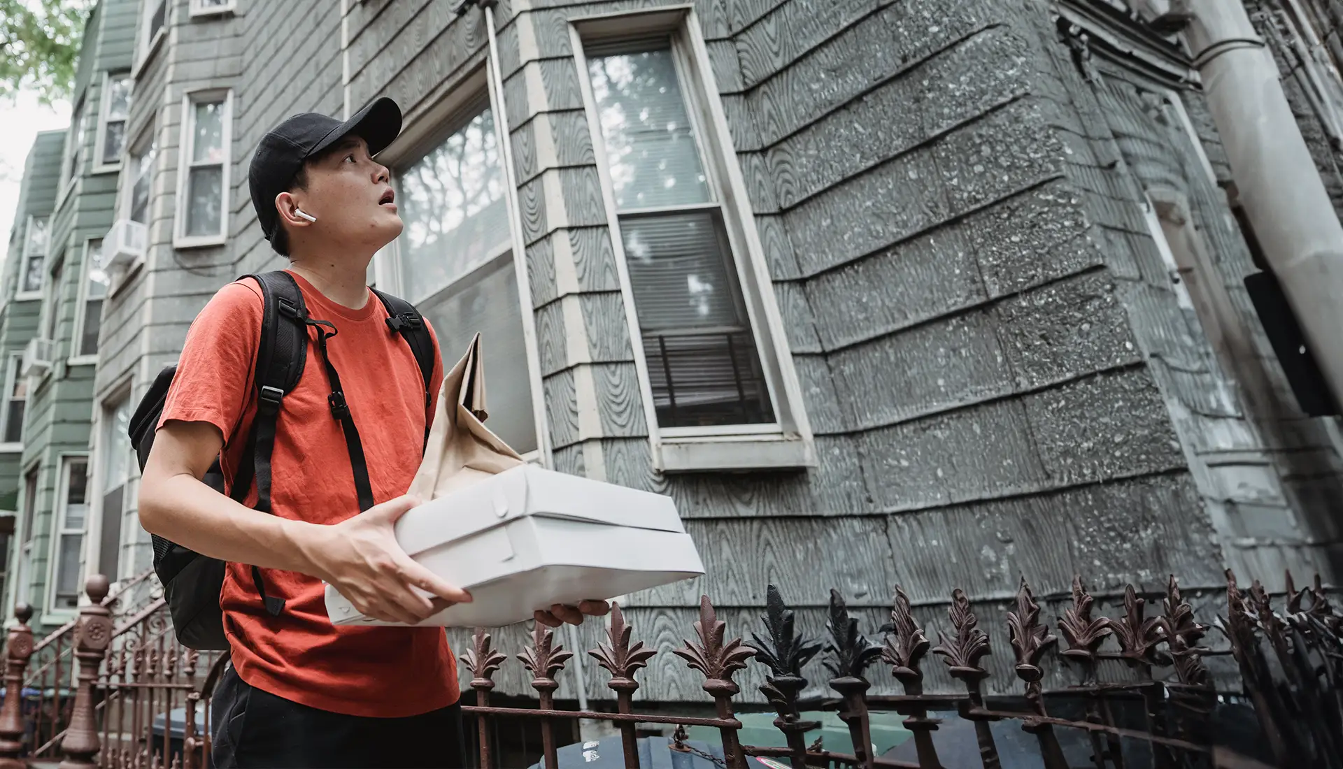 Delivery person looking for address